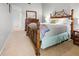 Well-lit bedroom features a wooden bed frame and matching furniture at 238 Southampton Dr # 319, Venice, FL 34293