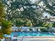 Community pool offers lounge chairs, tables, and a refreshing oasis for residents to relax and socialize at 238 Southampton Dr # 319, Venice, FL 34293