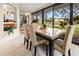 Dining room with stone table and four chairs with views of a lake at 238 Southampton Dr # 319, Venice, FL 34293