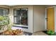 Inviting entrance showcasing a well-lit walkway, beautiful landscaping, and a glimpse of the home's interior at 238 Southampton Dr # 319, Venice, FL 34293