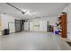 Spacious garage with painted floor and white storage cabinets, attached to home at 238 Southampton Dr # 319, Venice, FL 34293