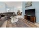 Bright living room with a sectional sofa, round coffee table and a large TV with a wooden stand at 238 Southampton Dr # 319, Venice, FL 34293