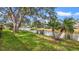 Picturesque pond view enhanced by mature trees and landscaping creating a serene environment at 238 Southampton Dr # 319, Venice, FL 34293