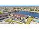 Beautiful aerial view of the complex with water views, a pool, and covered parking at 240 Lewis Cir # 28, Punta Gorda, FL 33950