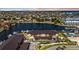 Aerial view of a multifamily building complex with a community pool, private docks, and waterway access at 240 Lewis Cir # 28, Punta Gorda, FL 33950