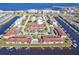 Aerial view of waterfront complex with boat docks on a canal with ocean access at 240 Lewis Cir # 28, Punta Gorda, FL 33950