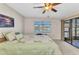 Bright bedroom overlooking the water with a sliding glass door at 240 Lewis Cir # 28, Punta Gorda, FL 33950