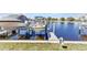 A private dock with a boat lift highlights waterfront living at 240 Lewis Cir # 28, Punta Gorda, FL 33950
