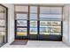 Water view from this bright and airy lanai featuring tile flooring and peaceful scenery at 240 Lewis Cir # 28, Punta Gorda, FL 33950