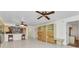 Open-concept living room boasts tile flooring, modern fixtures, and bright natural light at 240 Lewis Cir # 28, Punta Gorda, FL 33950
