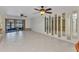 An expansive living room that is well-lit and leads to an enclosed patio at 240 Lewis Cir # 28, Punta Gorda, FL 33950