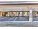 Assigned parking space with covered area, signage and view of property at 240 Lewis Cir # 28, Punta Gorda, FL 33950