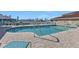 Community pool featuring clear blue water and ample lounge chairs at 240 Lewis Cir # 28, Punta Gorda, FL 33950