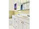 Bathroom featuring a double sink vanity with white cabinets and ample counter space at 2715 Taylor Rd, Punta Gorda, FL 33950