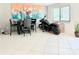 Bright dining room featuring a 3-piece table set and sleek black motorcycle at 2715 Taylor Rd, Punta Gorda, FL 33950