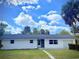 Charming single-story home with a well-maintained lawn and a bright white exterior finish at 2715 Taylor Rd, Punta Gorda, FL 33950