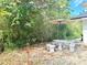 Charming patio with a quaint outdoor seating area and a classic tiki torch at 2715 Taylor Rd, Punta Gorda, FL 33950