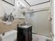 Classic bathroom with a vanity, tiled shower, and dark accents at 301 Palmetto Ne Dr, Port Charlotte, FL 33952