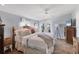 Bright bedroom featuring french doors, herringbone floors, and soft blue walls at 301 Palmetto Ne Dr, Port Charlotte, FL 33952