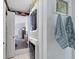 Functional laundry area with a stacked washer and dryer near the bedroom at 301 Palmetto Ne Dr, Port Charlotte, FL 33952