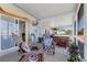 Inviting outdoor patio with an Adirondack chair and a relaxing hot tub, perfect for enjoying quiet moments at 301 Palmetto Ne Dr, Port Charlotte, FL 33952
