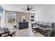 Bright sun room with multiple windows, neutral walls, comfortable seating and tile floors at 301 Palmetto Ne Dr, Port Charlotte, FL 33952