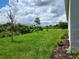 Expansive backyard with lush green grass and freshly mulched garden bed at 354 Porto Alegre St, Punta Gorda, FL 33983