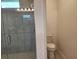 Bathroom view with tiled shower and toilet at 354 Porto Alegre St, Punta Gorda, FL 33983