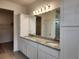 Bathroom featuring double sink vanity with granite countertop at 354 Porto Alegre St, Punta Gorda, FL 33983