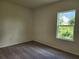 Vacant bedroom featuring carpeted floors and a window letting in natural light at 354 Porto Alegre St, Punta Gorda, FL 33983