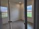 Clean bedroom featuring tile floors, white walls, and a closet with mirrored doors at 354 Porto Alegre St, Punta Gorda, FL 33983