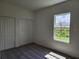 A vacant bedroom with two closets, a window, and carpeted floors at 354 Porto Alegre St, Punta Gorda, FL 33983