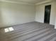 A view of a vacant main bedroom, featuring carpeted floors and an attached bathroom at 354 Porto Alegre St, Punta Gorda, FL 33983