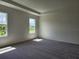 Vacant main bedroom with carpeted floors and ample light from the windows at 354 Porto Alegre St, Punta Gorda, FL 33983