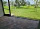 Spacious tiled screened porch overlooking lush backyard and beautiful landscaping at 354 Porto Alegre St, Punta Gorda, FL 33983