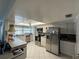 Bright kitchen featuring white cabinetry, modern appliances, and tile flooring at 548 Belvedere Ct, Punta Gorda, FL 33950
