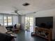 Light-filled living room with tile floors, modern decor, and sliding door access at 548 Belvedere Ct, Punta Gorda, FL 33950