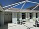 Relaxing covered patio with outdoor seating near the home's entrance at 548 Belvedere Ct, Punta Gorda, FL 33950