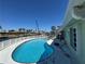 Backyard pool featuring a fence, ladder, patio, and canal view at 548 Belvedere Ct, Punta Gorda, FL 33950