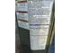 Close-up of electrical warning labels highlighting the risk of electric shock and cancer causing agents at 548 Belvedere Ct, Punta Gorda, FL 33950