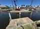 Waterway with crane, equipment, and workers on platform, waterway project underway at 548 Belvedere Ct, Punta Gorda, FL 33950