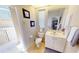 Half bathroom features a tile floor, vanity sink, and toilet at 569 Royal Poinciana, Punta Gorda, FL 33955