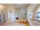 Bright bathroom with walk-in shower, soaking tub under an arched window, and tile floors at 569 Royal Poinciana, Punta Gorda, FL 33955