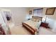 Bedroom with neutral colors, carpeted floor, and wood furniture at 569 Royal Poinciana, Punta Gorda, FL 33955