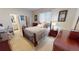 Bedroom features a comfortable bed, ensuite bathroom access, and window at 569 Royal Poinciana, Punta Gorda, FL 33955