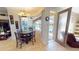 Cozy breakfast nook with chandelier lighting next to lanai and pool at 569 Royal Poinciana, Punta Gorda, FL 33955
