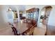 Formal dining room featuring a large wooden table and ornate china cabinet at 569 Royal Poinciana, Punta Gorda, FL 33955