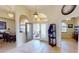Inviting home foyer with a chandelier, tiled flooring, an arched entryway, and a view of the front porch at 569 Royal Poinciana, Punta Gorda, FL 33955