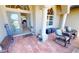 Inviting front porch with tiled flooring, decorative columns, cozy seating, and a 'welcome' mat at 569 Royal Poinciana, Punta Gorda, FL 33955