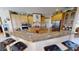 Gourmet kitchen featuring granite counters, stainless appliances, and breakfast bar at 569 Royal Poinciana, Punta Gorda, FL 33955
